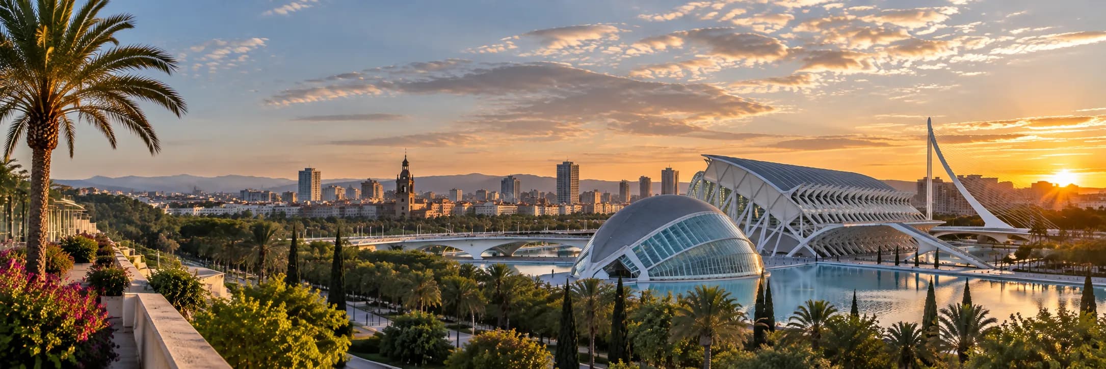 Valencia at sunset from the Turia gardens, with the Hemisferic and the Principe Felipe museum of the City of Arts and Sciences, the Assut de l'Or bridge and the city skyline behind.